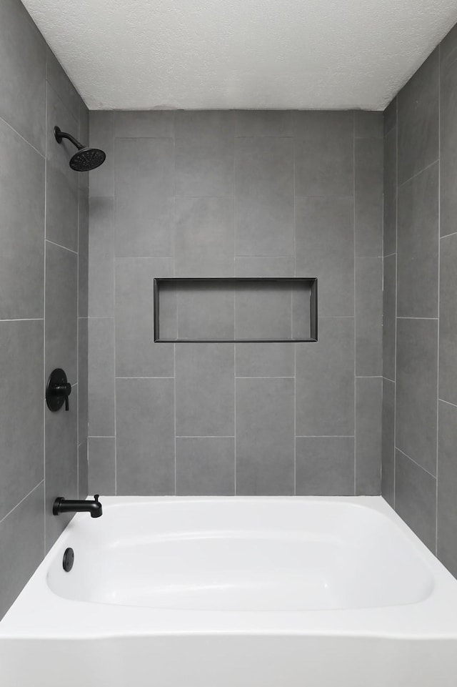 314 E Front St, Colfax, IA 50054 - full bath with shower / tub combination and a textured ceiling