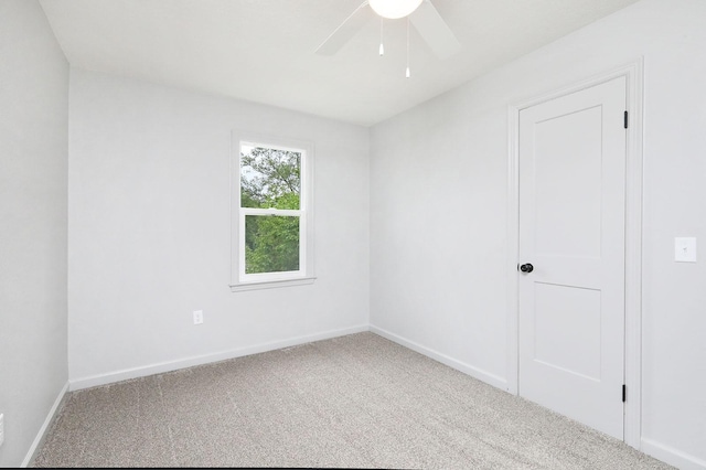 314 E Front St, Colfax, IA 50054 - carpeted spare room featuring a ceiling fan and baseboards