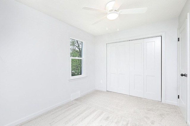314 E Front St, Colfax, IA 50054 - unfurnished bedroom featuring carpet floors, a closet, and baseboards