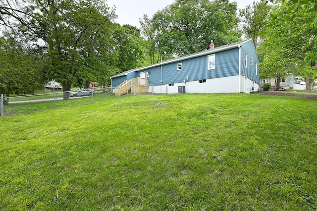 314 E Front St, Colfax, IA 50054 - back of property featuring a chimney and view of wooded area