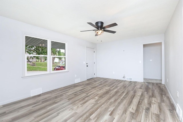 314 E Front St, Colfax, IA 50054 - empty room featuring light wood finished floors and a ceiling fan