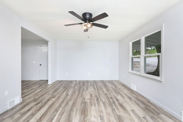 314 E Front St, Colfax, IA 50054 - spare room with light wood-type flooring, baseboards, and a ceiling fan