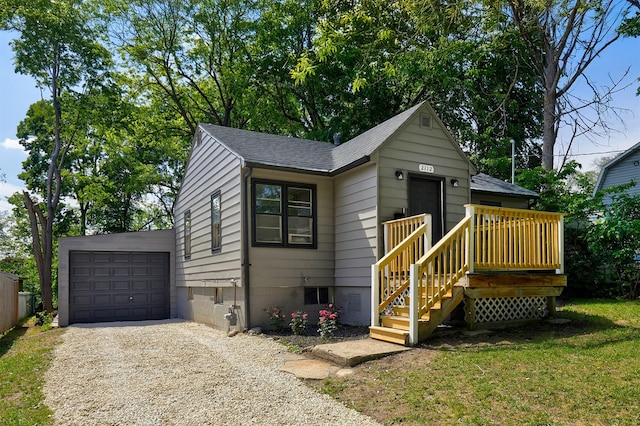 2112 E 23rd St, Des Moines, IA 50317 - view of front of home featuring gravel driveway, a shingled roof, and an outbuilding