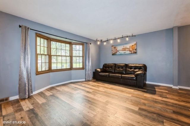 4305 65th St, Urbandale, IA 50322 - living room featuring wood finished floors and baseboards