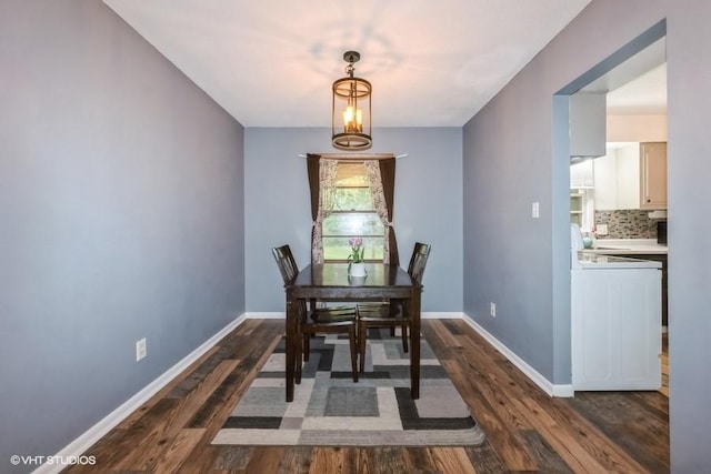 4305 65th St, Urbandale, IA 50322 - dining space featuring dark wood-style floors and baseboards