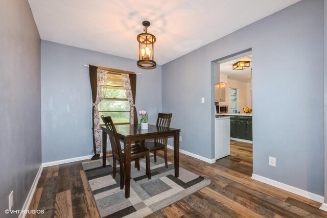 4305 65th St, Urbandale, IA 50322 - dining area with dark wood finished floors and baseboards