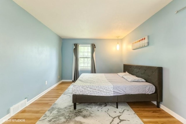 4305 65th St, Urbandale, IA 50322 - bedroom with wood finished floors and baseboards