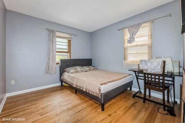 4305 65th St, Urbandale, IA 50322 - bedroom with light wood-style flooring and baseboards