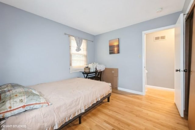 4305 65th St, Urbandale, IA 50322 - bedroom with wood finished floors and baseboards