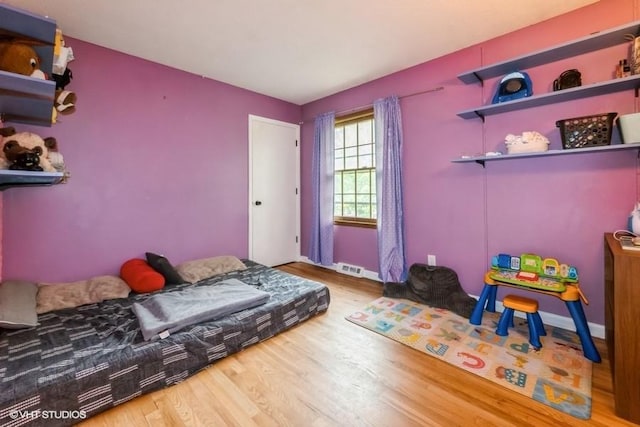 4305 65th St, Urbandale, IA 50322 - bedroom with wood finished floors and baseboards