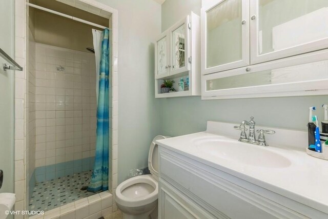 4305 65th St, Urbandale, IA 50322 - full bath with toilet, a shower stall, and vanity
