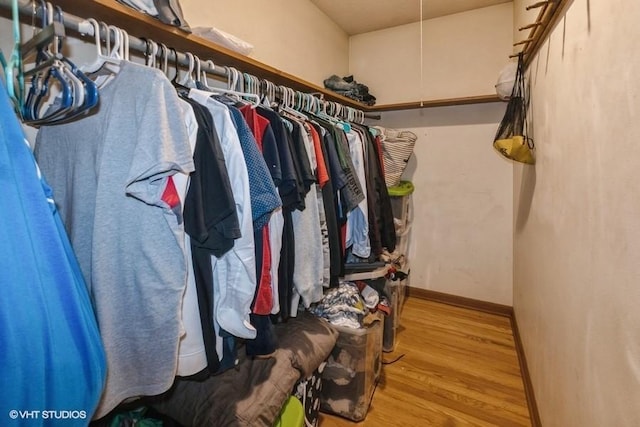 4305 65th St, Urbandale, IA 50322 - walk in closet featuring wood finished floors