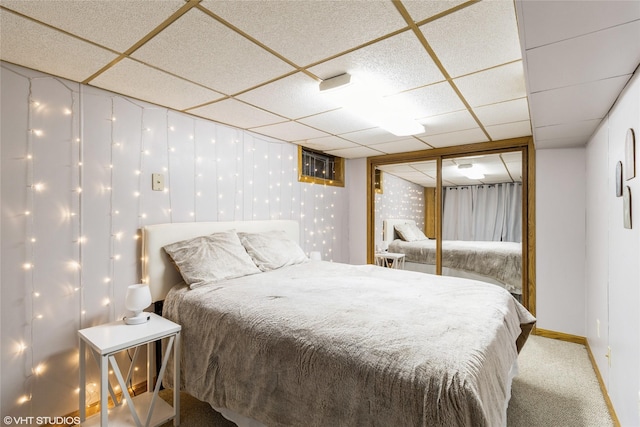 529 NW State St, Ankeny, IA 50023 - carpeted bedroom featuring a paneled ceiling and baseboards