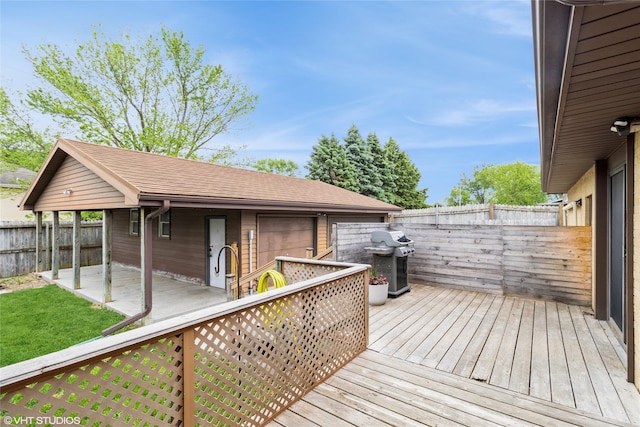 529 NW State St, Ankeny, IA 50023 - deck with a fenced backyard, a grill, and a detached garage