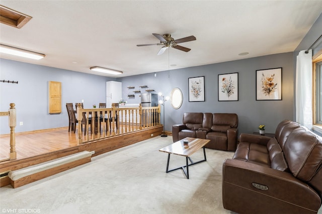 529 NW State St, Ankeny, IA 50023 - living room with ceiling fan, light carpet, and baseboards