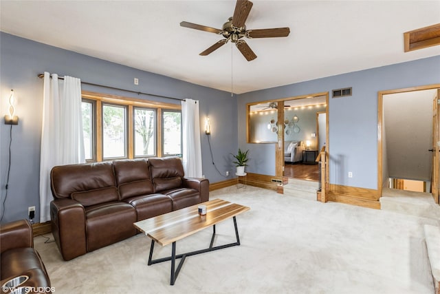529 NW State St, Ankeny, IA 50023 - carpeted living room with baseboards and ceiling fan