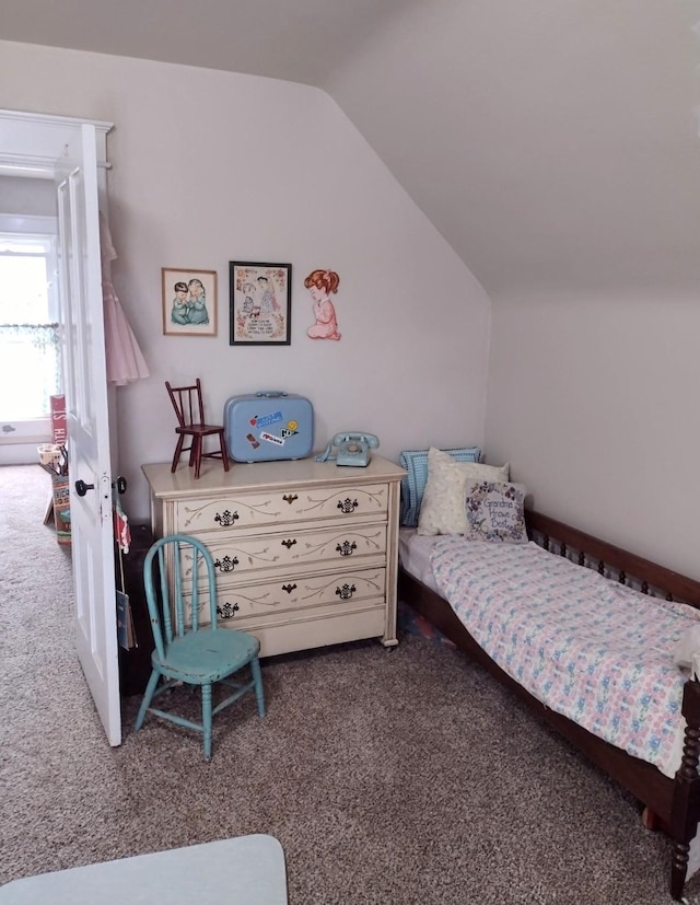 318 W Green St, Winterset, IA 50273 - bedroom with carpet and vaulted ceiling