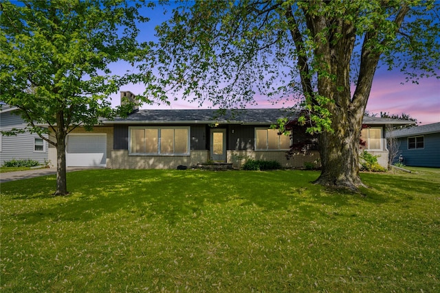 743 15th St, Nevada, IA 50201 - single story home featuring a garage, a front yard, driveway, and a chimney