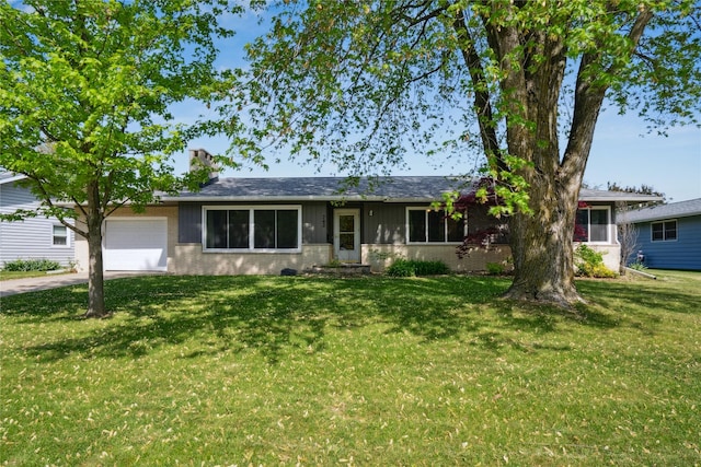 743 15th St, Nevada, IA 50201 - single story home featuring an attached garage, a front lawn, concrete driveway, and a chimney