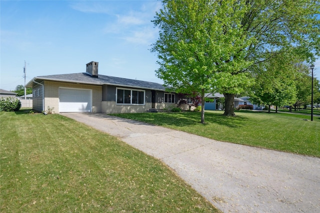743 15th St, Nevada, IA 50201 - ranch-style house with an attached garage, asphalt driveway, a front lawn, a chimney, and brick siding