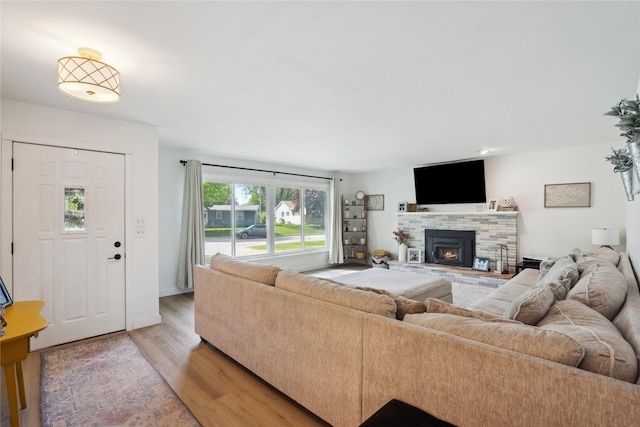 743 15th St, Nevada, IA 50201 - living area featuring light wood-style floors and a fireplace