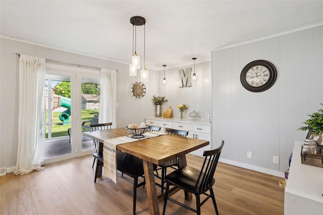 743 15th St, Nevada, IA 50201 - dining area with light wood-style floors, ornamental molding, and baseboards
