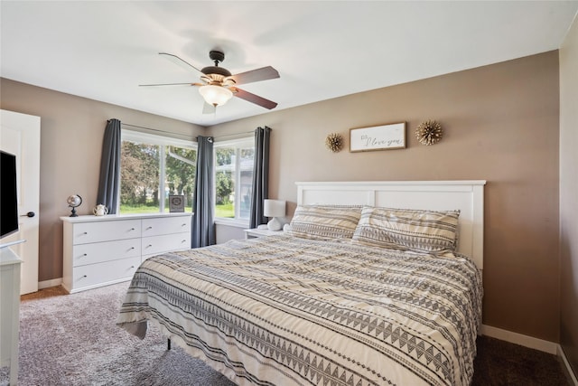743 15th St, Nevada, IA 50201 - carpeted bedroom featuring baseboards and a ceiling fan