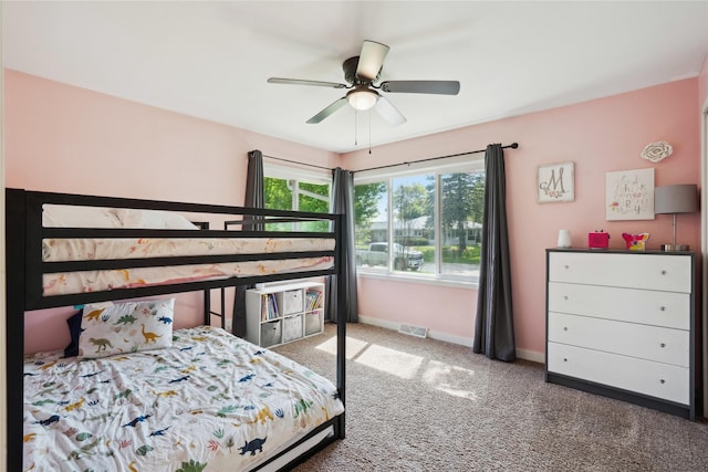 743 15th St, Nevada, IA 50201 - carpeted bedroom with baseboards and ceiling fan