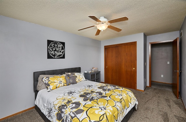 4230 SE 23rd St, Des Moines, IA 50320 - carpeted bedroom featuring a closet, baseboards, ceiling fan, and a textured ceiling