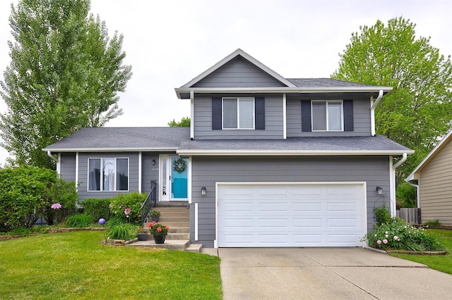 4230 SE 23rd St, Des Moines, IA 50320 - view of front of home featuring an attached garage, a front yard, concrete driveway, and a shingled roof