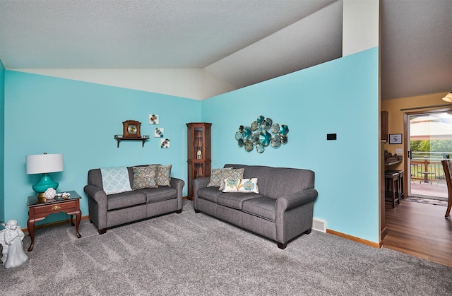 4230 SE 23rd St, Des Moines, IA 50320 - living room with carpet flooring, lofted ceiling, and baseboards