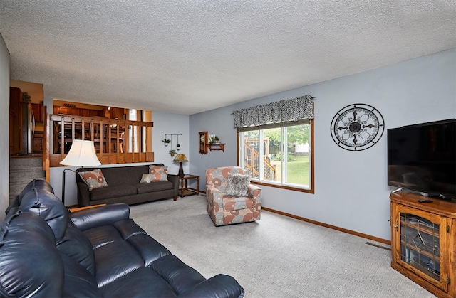4230 SE 23rd St, Des Moines, IA 50320 - living area with carpet floors, baseboards, and a textured ceiling