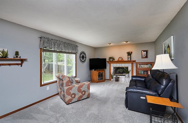 4230 SE 23rd St, Des Moines, IA 50320 - living area with carpet floors, baseboards, and a tiled fireplace