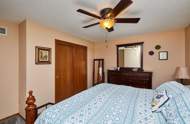 4230 SE 23rd St, Des Moines, IA 50320 - bedroom with a closet, a textured ceiling, ceiling fan, carpet, and baseboards