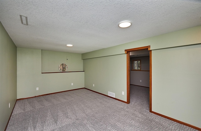 4230 SE 23rd St, Des Moines, IA 50320 - finished below grade area with carpet flooring, baseboards, and a textured ceiling