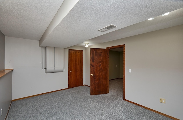 4230 SE 23rd St, Des Moines, IA 50320 - carpeted spare room with baseboards and a textured ceiling