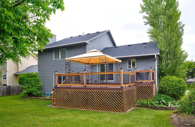 4230 SE 23rd St, Des Moines, IA 50320 - rear view of house featuring a gazebo, a deck, roof with shingles, and a chimney