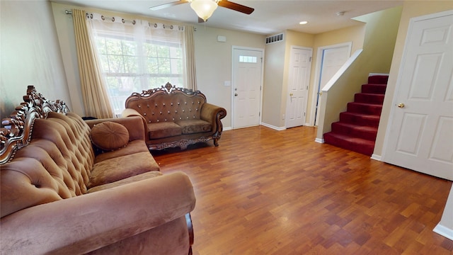 1534 18th St, Des Moines, IA 50314 - living area featuring ceiling fan, wood finished floors, stairway, baseboards, and recessed lighting