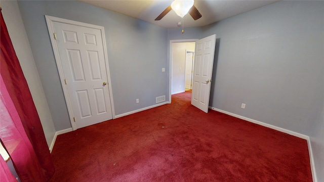 1534 18th St, Des Moines, IA 50314 - unfurnished bedroom with carpet, baseboards, and a ceiling fan