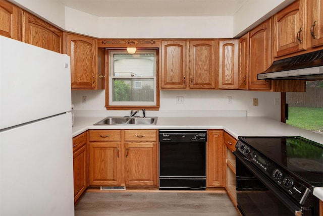 7405 Aurora Ave, Urbandale, IA 50322 - kitchen featuring freestanding refrigerator, dishwasher, electric range oven, a sink, and under cabinet range hood