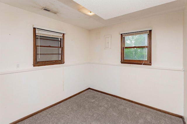 7405 Aurora Ave, Urbandale, IA 50322 - spare room featuring carpet floors and baseboards
