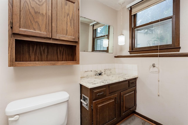 7405 Aurora Ave, Urbandale, IA 50322 - bathroom featuring toilet and vanity