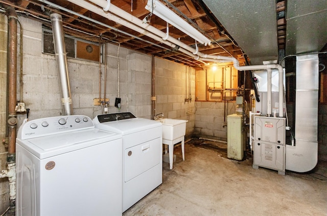 7405 Aurora Ave, Urbandale, IA 50322 - washroom featuring washer and dryer and heating unit