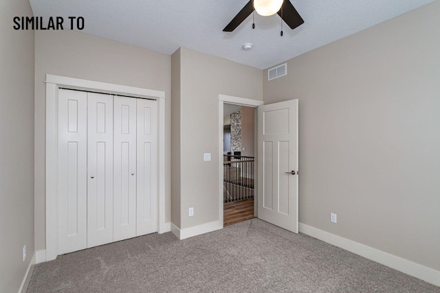 532 Wicker Dr, Huxley, IA 50124 - unfurnished bedroom with carpet, baseboards, a closet, and ceiling fan