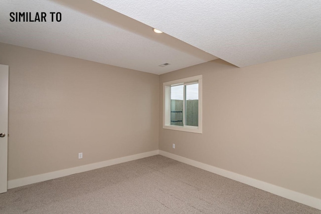 532 Wicker Dr, Huxley, IA 50124 - empty room with light carpet, baseboards, and a textured ceiling
