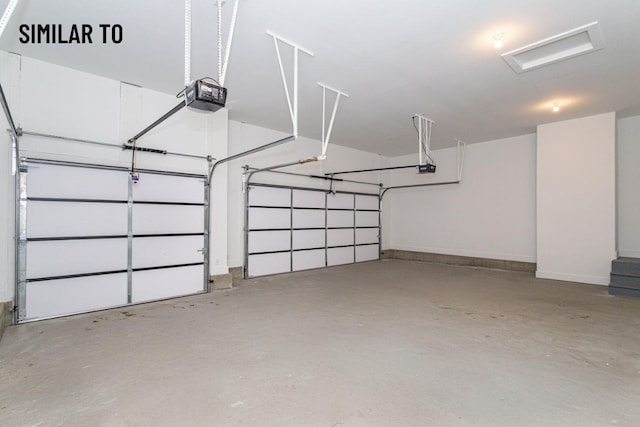 532 Wicker Dr, Huxley, IA 50124 - garage with a garage door opener and baseboards