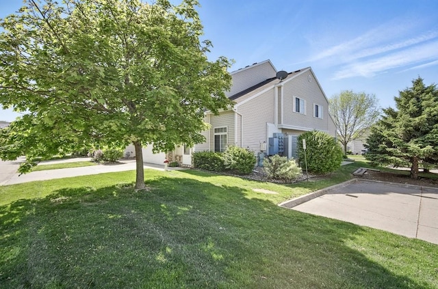 3799 Village Run Dr Unit 512, Des Moines, IA 50317 - view of home's exterior with a yard