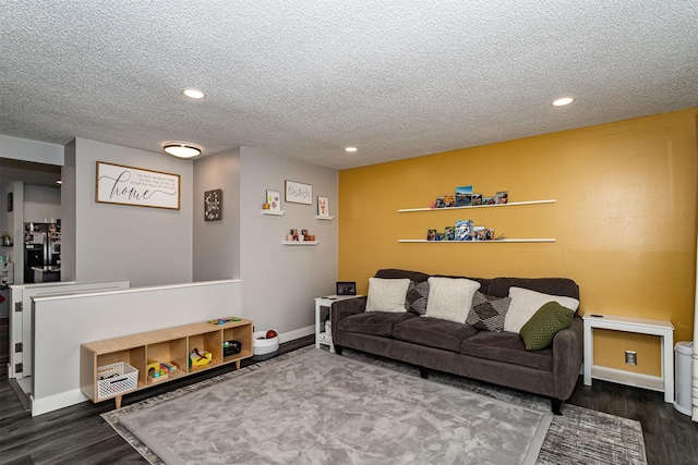 405 Joy Cir, Gilbert, IA 50105 - living area featuring wood finished floors, a textured ceiling, recessed lighting, and baseboards