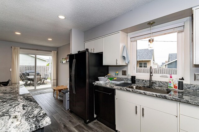 405 Joy Cir, Gilbert, IA 50105 - kitchen featuring black appliances, a textured ceiling, a sink, white cabinets, and dark wood-type flooring
