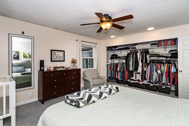 405 Joy Cir, Gilbert, IA 50105 - carpeted bedroom with a closet, a textured ceiling, a ceiling fan, baseboards, and recessed lighting
